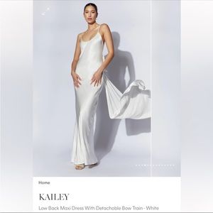 Kailey Low Back Maxi Dress With Detachable Bow Train - White
Size: M